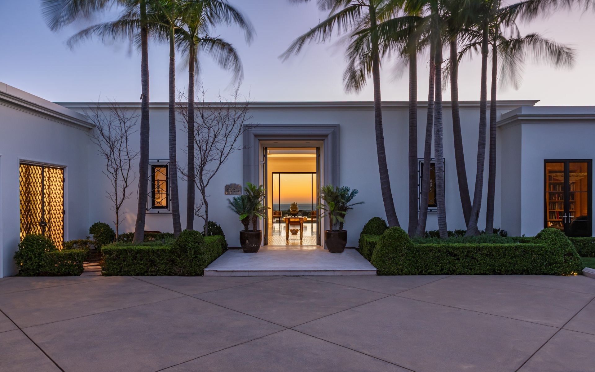 Entry at dusk, framing the view through the house