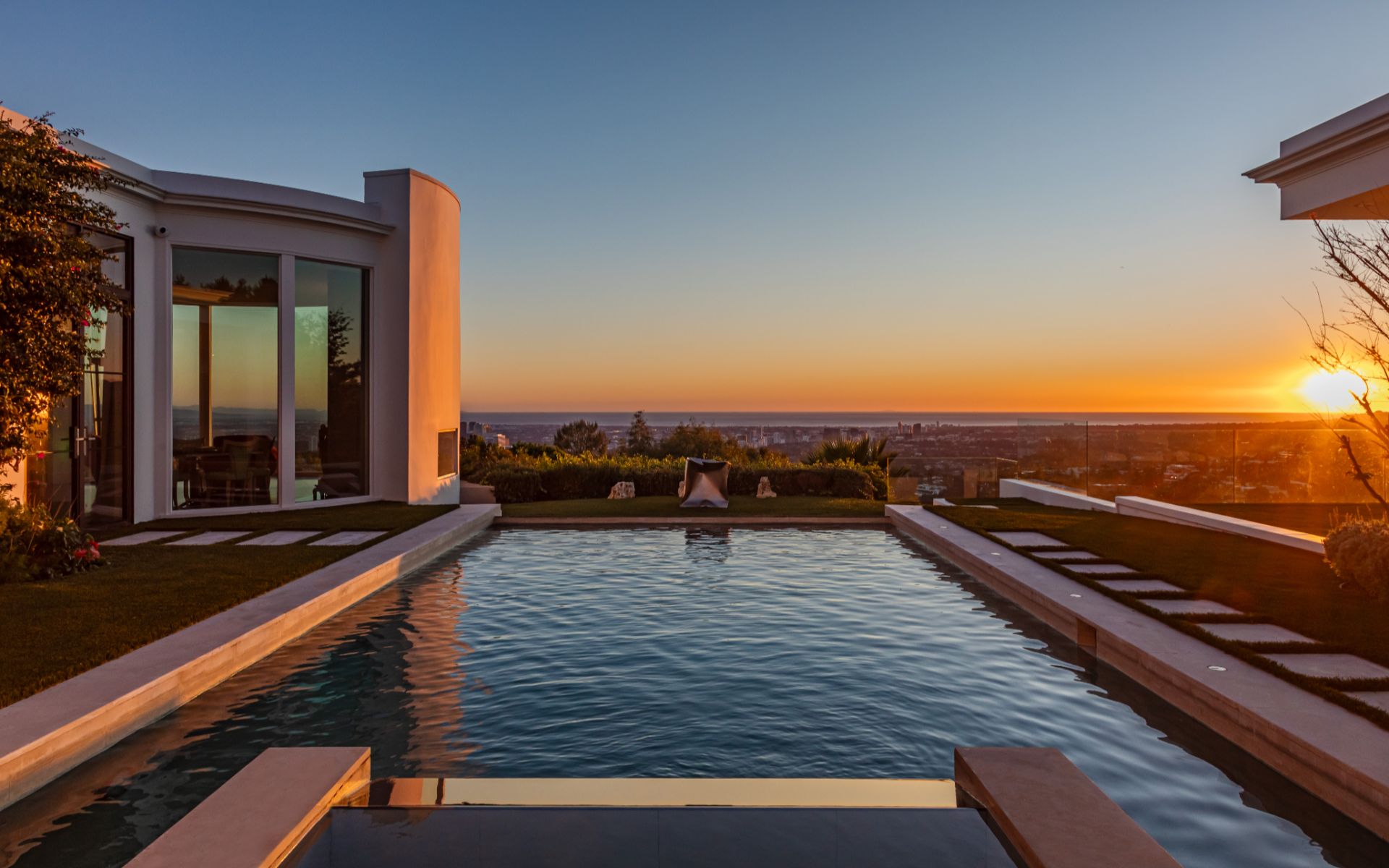 Pool terrace at sunset over the city