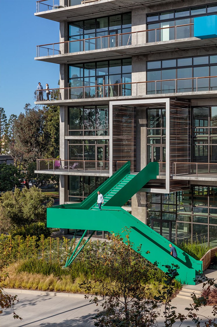 Green exterior stair descending to the landscape