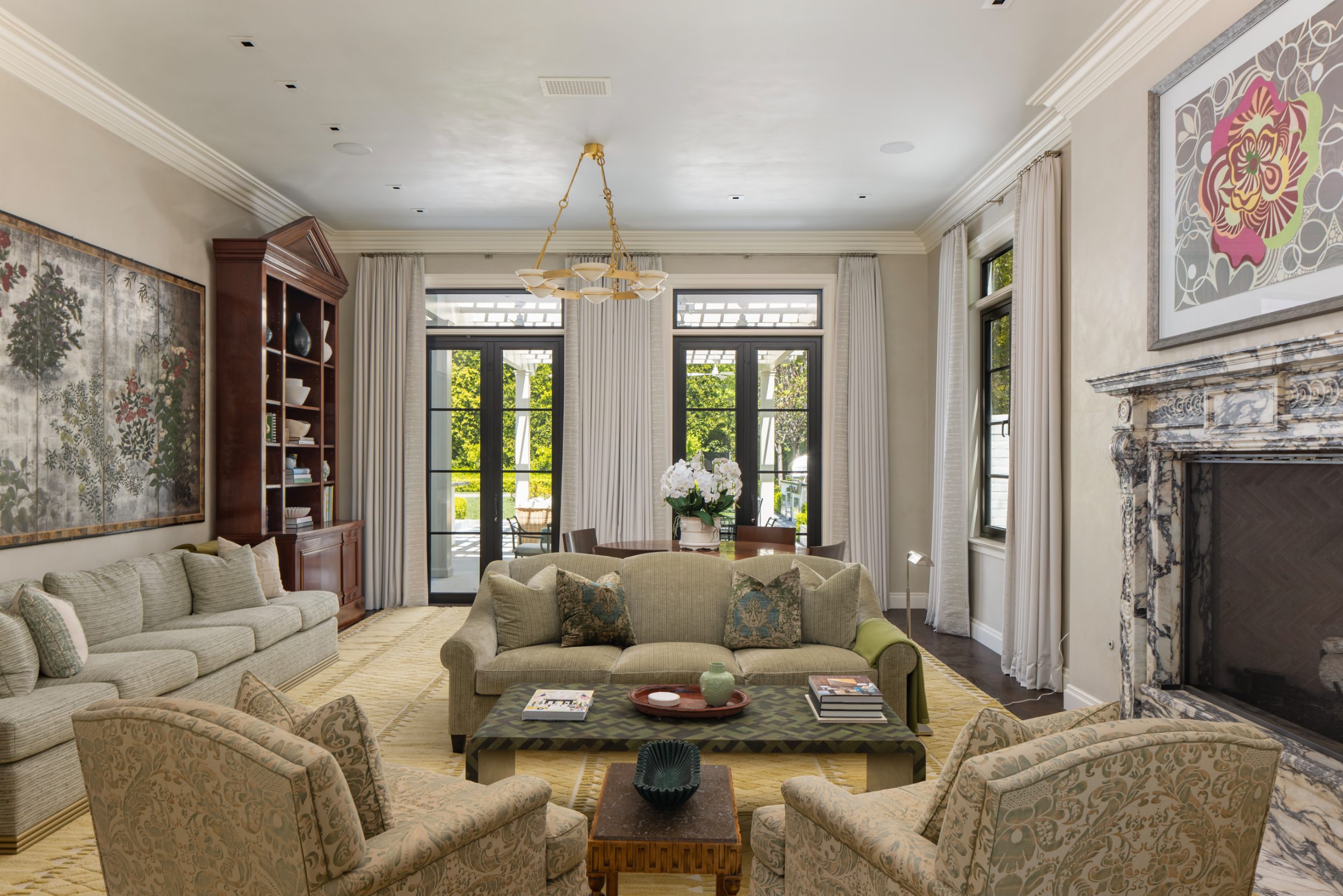 Formal living room with marble mantel