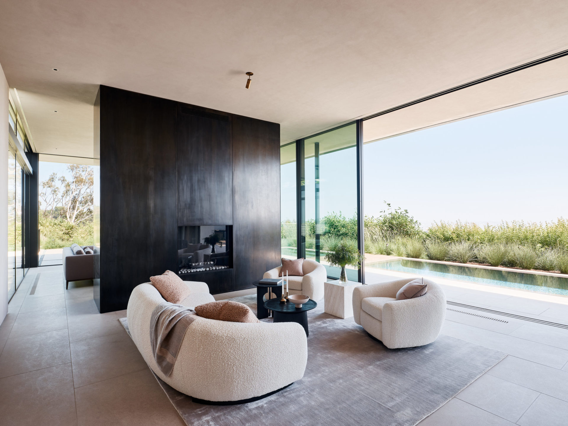 Living room with blackened-steel fireplace