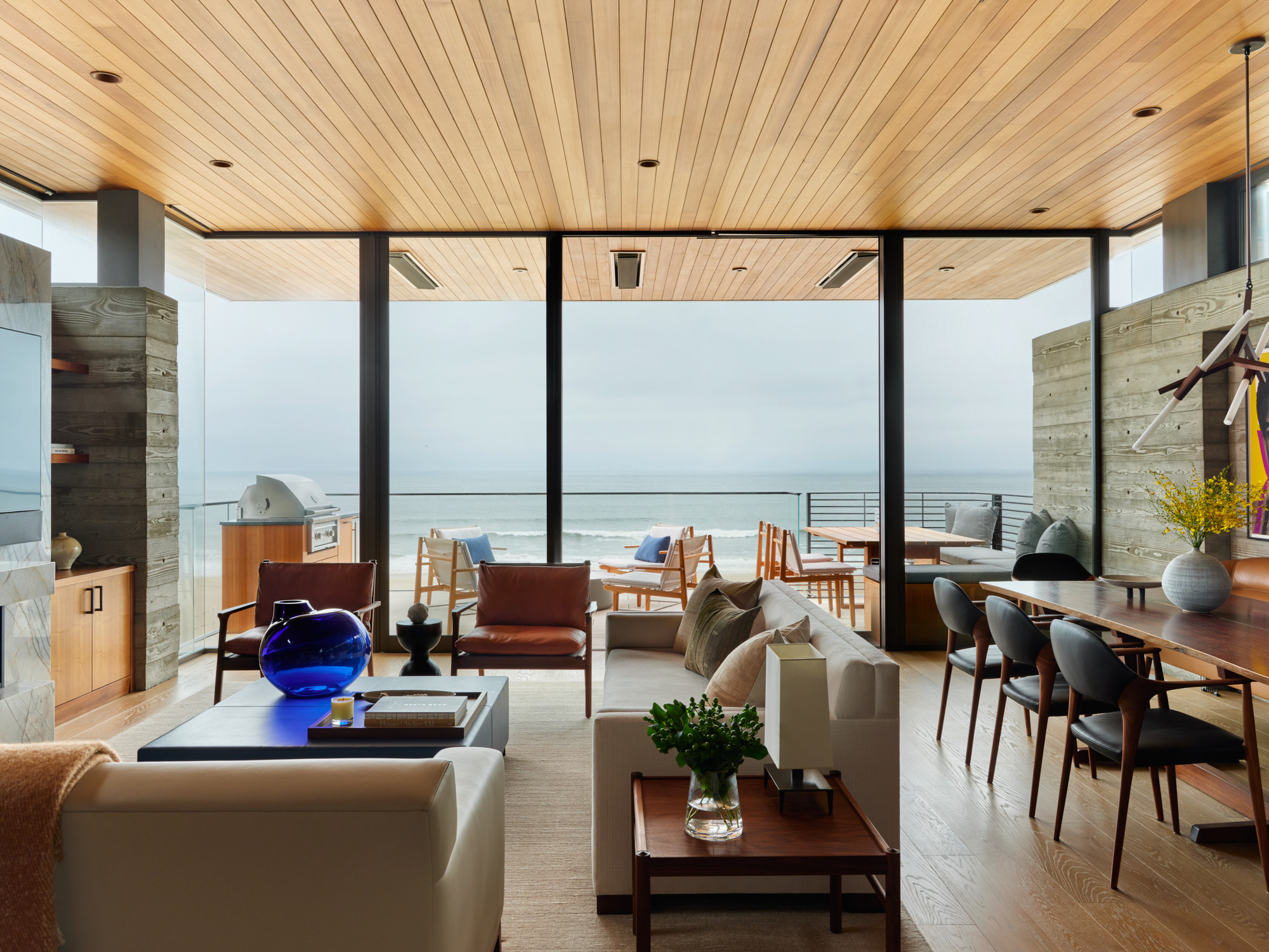 The Strand living room opening to the ocean